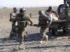 Soldiers from the Afghan National Army, 1st Brigade, 203rd Corps, rush to employ their 82mm mortar system during a live-fire exercise that marked the conclusion of a two-week mortarmen course at the Fires Center of Excellence, Camp Parsa, Afghanistan, Jan. 3, 2013. Once they have completed the required training, the trainees must exhibit their abilities to successfully employ and utilize their weapon system. (U.S. Army photo by 1st Lt. Bryan Spear, 3-320th FA, Unit Public Affairs Representative)
