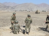 A soldier from the Afghan National Army, 1st Brigade, 203rd Corps, corrects his fellow soldiers on a particular sequence they missed during a live-fire exercise that marked the conclusion of a two-week mortarmen course at the Fires Center of Excellence, Camp Parsa, Afghanistan, Jan. 3, 2013. Once they have completed the required training, the trainees must exhibit their abilities to successfully employ and utilize their weapon system. (U.S. Army photo by Sgt. 1st Class Abram Pinnington, TF 3/101 Public Affairs)
