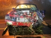 The Ford Mustang after it was pulled out of the embankment and loaded onto a tow truck. (Photo by CPD-Jim Knoll)