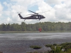 Water gets kicked up as a helicopter with A Company, 6th Battalion, 101st Combat Aviation Brigade, 101st Airborne Division (Air Assault) comes in to a hover over Lake Kyle to fill a water bucket up during wildfire training at Fort Campbell, Ky., August 19, 2013. (U.S. Army photo by Sgt. Duncan Brennan, 101st CAB Public Affairs)