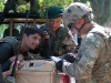U.S. Army 1st Sgt. Christopher Carey, first sergeant, Security Forces Advisory and Assistance Team Archangel, 1st Brigade Combat Team, 101st Airborne Division, of Springtown, Texas, confers with Afghan National Army soldiers on the outskirts of the village of Takiya Khana, Bati Kot district, Nangarhar Province, Afghanistan, June 15, 2013. (U.S. Army photo by Sgt. Margaret Taylor, 129th Mobile Public Affairs Detachment)