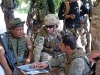 U.S. Army Capt. Nicholas Drake, commander, Security Forces Advisory and Assistance Team Archangel, 1st Brigade Combat Team, 101st Airborne Division, of Calabasas, Calif., confers with Afghan National Army Lt. Col. Mohammad Bashir, commander, 2nd Kandak, 4th Brigade, on the outskirts of the village of Takiya Khana, Bati Kot district, Nangarhar Province, Afghanistan, June 15, 2013. (U.S. Army photo by Sgt. Margaret Taylor, 129th Mobile Public Affairs Detachment)