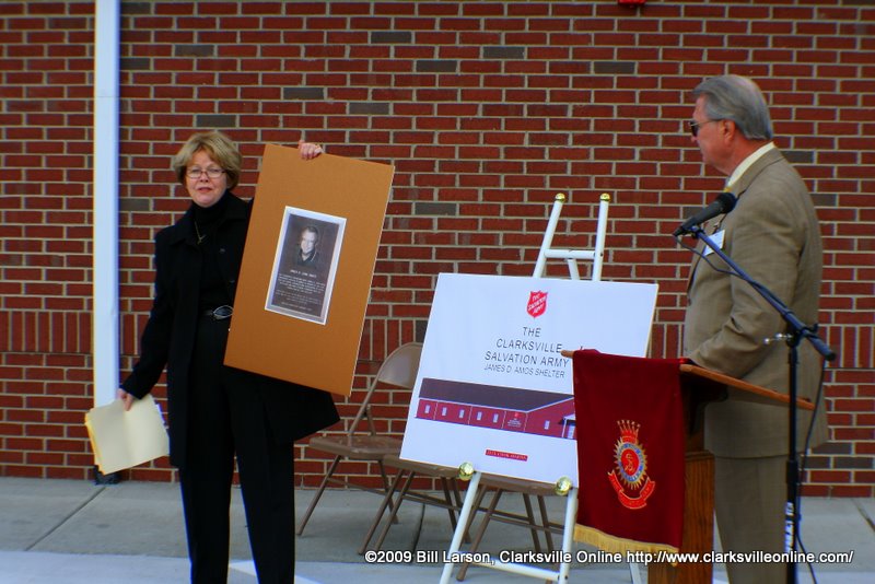 James D. Amos listens as the shelter is named after him