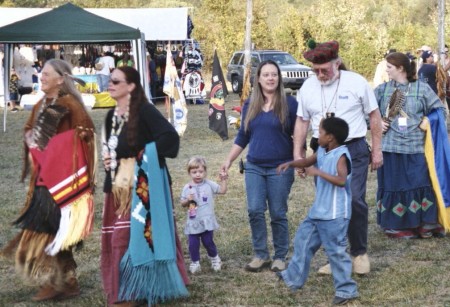 Native Women in Regalia dance during the Powwow
