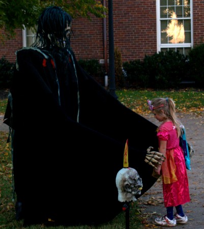A brave child approaches the ghoul.