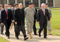 The President of Afghanistan, Hamid Karzai, Major General John Campbell the Commanding General of the 101st Airborne Division (Air Assault) "Screaming Eagles" and the U.S. Secretary of Defense, Robert Gates walk back to their aircraft at Campbell Army Airfield, Fort Campbell, KY on 14 May 2010.  The President of Afghanistan, the Secretaries of Defense for the U.S. and Afghanistan, the Chairman of the Joint Chiefs of Staff and other distinguished visitors were on a short visit to Fort Campbell.   U.S. Army Photo by Sam Shore