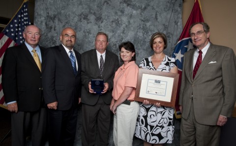 Environment and Conservation Commissioner Jim Fyke and Deputy Commissioner Paul Sloan present several representatives from the city of Clarksville and its Parks and Recreation team with the Greenways and Trails honor at the 2010 Governor’s Environmental Stewardship Awards, recently held in Nashville. ﻿