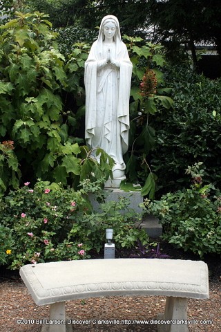 A statue of the Virigin Mary is the centerpiece of the Meditation Garden outside the Immaculate Conception Catholic Church