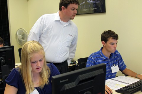 Students Michelle Ferguson, RHS, and  Jared Cornelius, NEHS, receive instruction from FCFCU training instructor David Wilhelm.