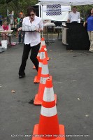 A young woman runs the obstacle course during Wait Staff Wars