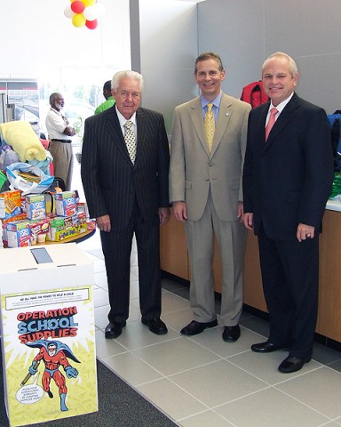 Mr. Gary Mathews and Mr O.B. Garland, Owner partners of Mathews Nissan, flank State Representative Joe Pitts as they survey the items donated for the Teacher's Warehouse during Mathews Nissan's "Operation School Supplies".