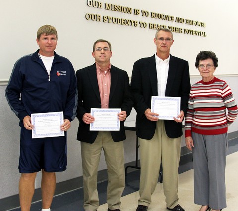 From left, award recipients include: Northeast basketball coach Al Cooper, Rossview athletic director John Miller, Rossview principal Frank Myers and School Board member Eula Gardner Dowdy.