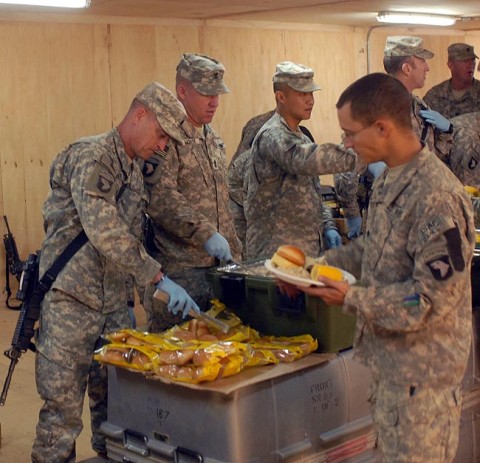U.S. Army Command Sgt. Maj. Greg Patton, from Vincennes, IN, senior non-commissioned officer for 3rd Brigade Combat Team, 101st Airborne Division, serves Christmas dinner to Soldiers of 1st Battalion, 187th Infantry Regiment, in Bak, Afghanistan, Dec. 25th. (U.S. Army Photo by Pfc. Chris McKenna) U.S. Army Command Sgt. Maj. Greg Patton, from Vincennes, IN, senior non-commissioned officer for 3rd Brigade Combat Team, 101st Airborne Division, serves Christmas dinner to Soldiers of 1st Battalion, 187th Infantry Regiment, in Bak, Afghanistan, Dec. 25th. (U.S. Army Photo by Pfc. Chris McKenna)