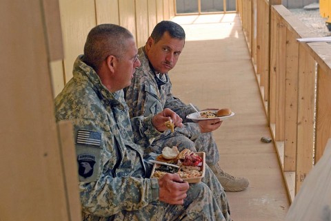 Two U.S. Army Soldiers eat Christmas dinner in Bak, Afghanistan, December 25th. (U.S. Army Photo by Pfc. Chris McKenna) Two U.S. Army Soldiers eat Christmas dinner in Bak, Afghanistan, December 25th. (U.S. Army Photo by Pfc. Chris McKenna)