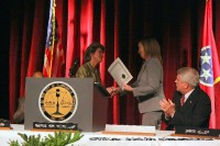 Mayor Kim McMillan receiving her Official Certificate of Election from Vickie Koelman, the Administrator of Elections