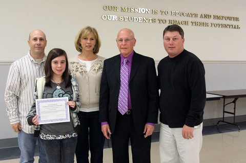 Point of Pride recipient Master Sgt. Clark Slone and his daughter Savannaha Slone stand with New Providence Middle School Principal Laura Barnett, School Board member Ernest Brockman and Middle Schools Director Sean Impeartrice at a recent School Board meeting.