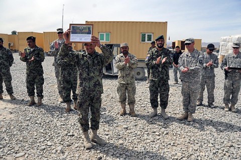 Noor Muhammad, an Afghan National Army route clearance noncommissioned officer, shows the award he received from Company A, 4th Brigade Special Troops Battalion, 4th Brigade Combat Team, 101st Airborne Division, Task Force Currahee, during a ceremony March 21st at Forward Operating Base Sharana. (U.S. Army photo by Spc. Kimberly K. Menzies, Task Force Currahee Public Affairs) Noor Muhammad, an Afghan National Army route clearance noncommissioned officer, shows the award he received from Company A, 4th Brigade Special Troops Battalion, 4th Brigade Combat Team, 101st Airborne Division, Task Force Currahee, during a ceremony March 21st at Forward Operating Base Sharana. (U.S. Army photo by Spc. Kimberly K. Menzies, Task Force Currahee Public Affairs)
