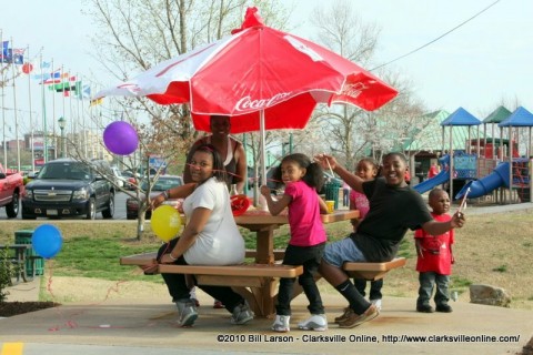 A family enjoying a meal together outdoors at the Riverside Drive Wendy's
