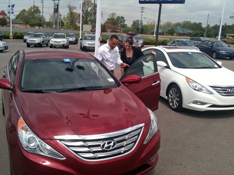 Wyatt Johnson salesperson Chris Crawford showing a customer the new Hyundai Elantra.