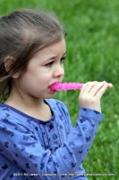 A young girl enjoys a tasty treat at the Rivers and Spires Festival