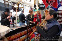 Flute music lures festival attendees into his shop