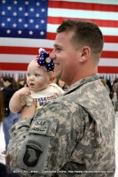 A soldier reunited with his young daughter