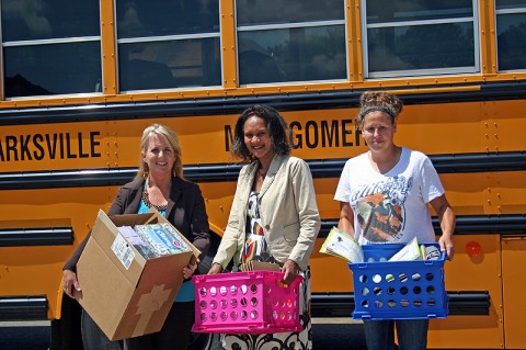 Volunteers helping to “Stuff the Bus” with much needed supplies and donations.