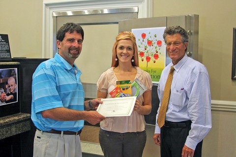 Cumberland Bank & Trust employee Nicole Sartain presented $68.00 and about 100 donated items to Clarksville Montgomery County Education Foundation Board members Jeff Burkhart (left) and Rudy Johnson.