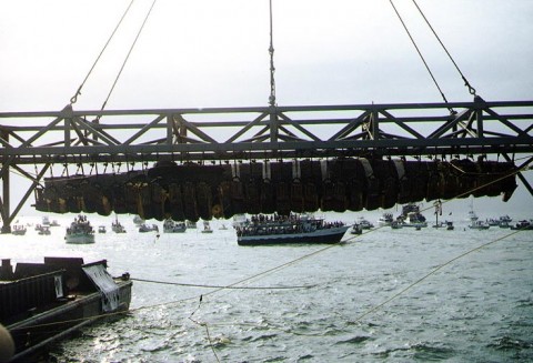 H. L. Hunley, suspended from a crane during its recovery from Charleston Harbor, August 8th, 2000. (Photograph from the U.S. Naval Historical Center.)