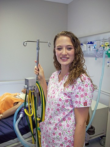 Sara Crotts stands beside some of the equipment she will use as a Certified Respiratory Therapist after completing of her degree at MMTC in respiratory therapy. (Photo by Lois Jones)