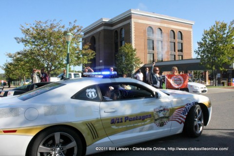 City Council Woman Kaye Jones fires the starting pistol as Clarksville Mayor Kim McMillan waves the flag kicking off the next leg of the 2011 Chevrolet Fireball Run Adventurally 