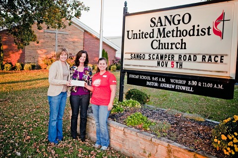 Habitat for Humanity of Montgomery County, TN accepts a donation from the Sango United Methodist Church (UMC).