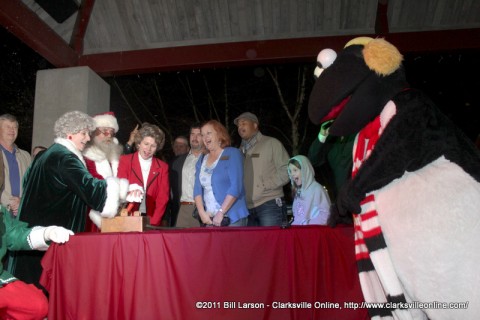 Clarksville Mayor Kim McMillan kicks off the 2011 Christmas on the Cumberland with the assistance of Santa and Mrs. Claus