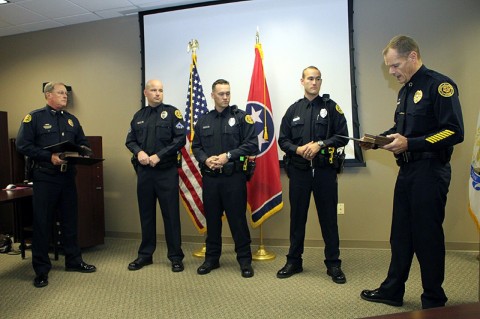 Deputy Chief Mike Parr, Officer Mark Wilson, Officer Jeff Danault, Officer Nathan Lee, and Chief Al Ansley—Chief reading the award citation. (Photo by CPD-Jim Knoll)