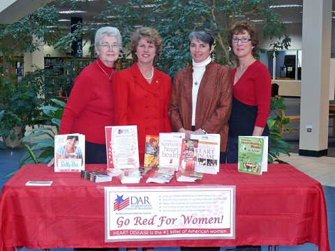 Chapter Registrar Elsie Smith, Mayor Kim McMillan, Library Director Martha Hendricks, and Chapter Regent Gail Longton gather to discuss Go Red For Women.  (Photo by Becky Poppleton)