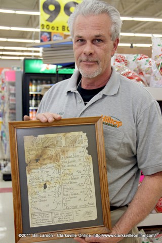 Store manager Mike Jackson with one of Hilltop Supermarket's original sales paper