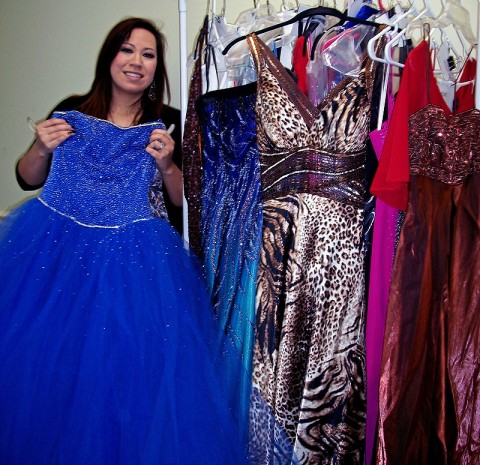 Maria Scott, High School Presenter for Miller-Motte, shows off some of the available dresses at Prom-O-Rama on Saturday. (Photo by: Lois Jones) Maria Scott, High School Presenter for Miller-Motte, shows off some of the available dresses at Prom-O-Rama on Saturday. (Photo by: Lois Jones)