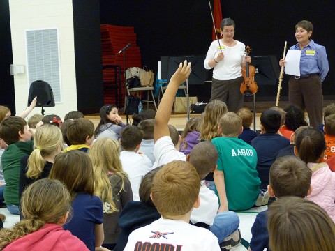 Kristi Seehafer and Norma Rogers quiz students after their performance.