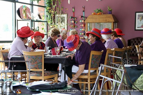 Women of The Red Hat Society enjoying Lunch at the Looking Glass Restaurant
