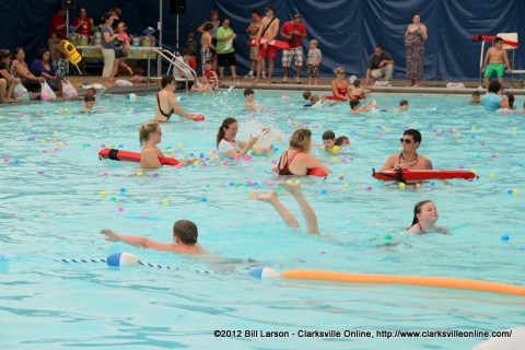 Kids gather eggs from the pool at the Indoor Aquatic Center during the City of Clarksville's Wettest Easter Egg Hunts