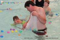 Sango Pool and Spa owner Paul Lobianco with his son during the Wettest Egg Hunt at the Indoor Aquatic Center