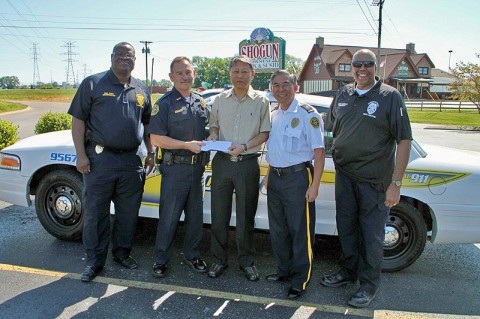 (Left to Right) Sgt J.W Hunt, Deputy Chief Frankie Gray, Business Owner Deok Kwon Nam, Chaplain David Lee, and Officer Tony Marshall. (Photo by CPD Jim Knoll)