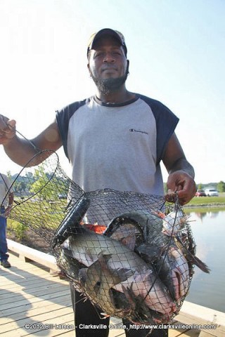 Darrell Cumo shows off his catch.