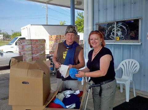 Manna Cafe' volunteer Craig Groomes )left) and Kaye Jones (right) go through the new items that will help keep people warm this winter.