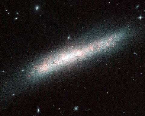 The galaxy NGC 4700 bears the signs of the vigorous birth of many new stars in this image captured by the NASA/ESA Hubble Space Telescope. (Image credit: ESA/NASA) The galaxy NGC 4700 bears the signs of the vigorous birth of many new stars in this image captured by the NASA/ESA Hubble Space Telescope. (Image credit: ESA/NASA)
