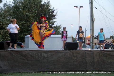  Ballet Folklorico Viva Panama's Carnival Queen Shanida Hatcher demonstrating the Salsa to the crowd on the River of Culture Stage