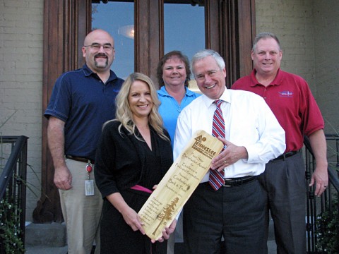 Four Star Benefactor Award for Cumberland Bank and Trust's sponsorship of the Queen City Road Race being presented.