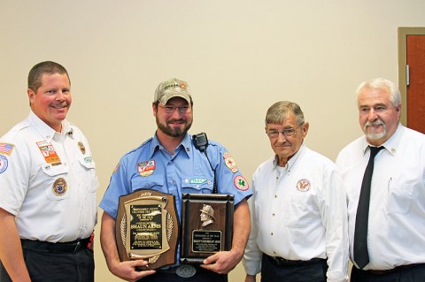 (L to R) Wade Kunstmann, Assistant Chief for the Cunningham Volunteer Fire Department; Shaun Arms, Overall 2012 Firefighter of the Year; Jerry Buchanan, Montgomery County Fire Chief; and Ed Baggett, Assistant Montgomery County Fire Chief.