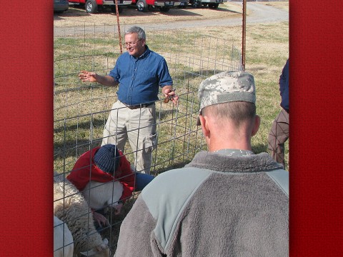 Bob Moore instructs a group of soldiers on how to care for livestock in Afghanistan. (Photo by Dr. Don Sudbrink/APSU).