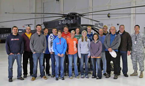 Members of the Friendship Christian Reform Church capture a memory of their visit in front of an AH-6M Little Bird helicopter during a visit to the General Brown compound December 7th. at Fort Campbell, KY. (160th SOAR (A) courtesy photo) Members of the Friendship Christian Reform Church capture a memory of their visit in front of an AH-6M Little Bird helicopter during a visit to the General Brown compound December 7th. at Fort Campbell, KY. (160th SOAR (A) courtesy photo)